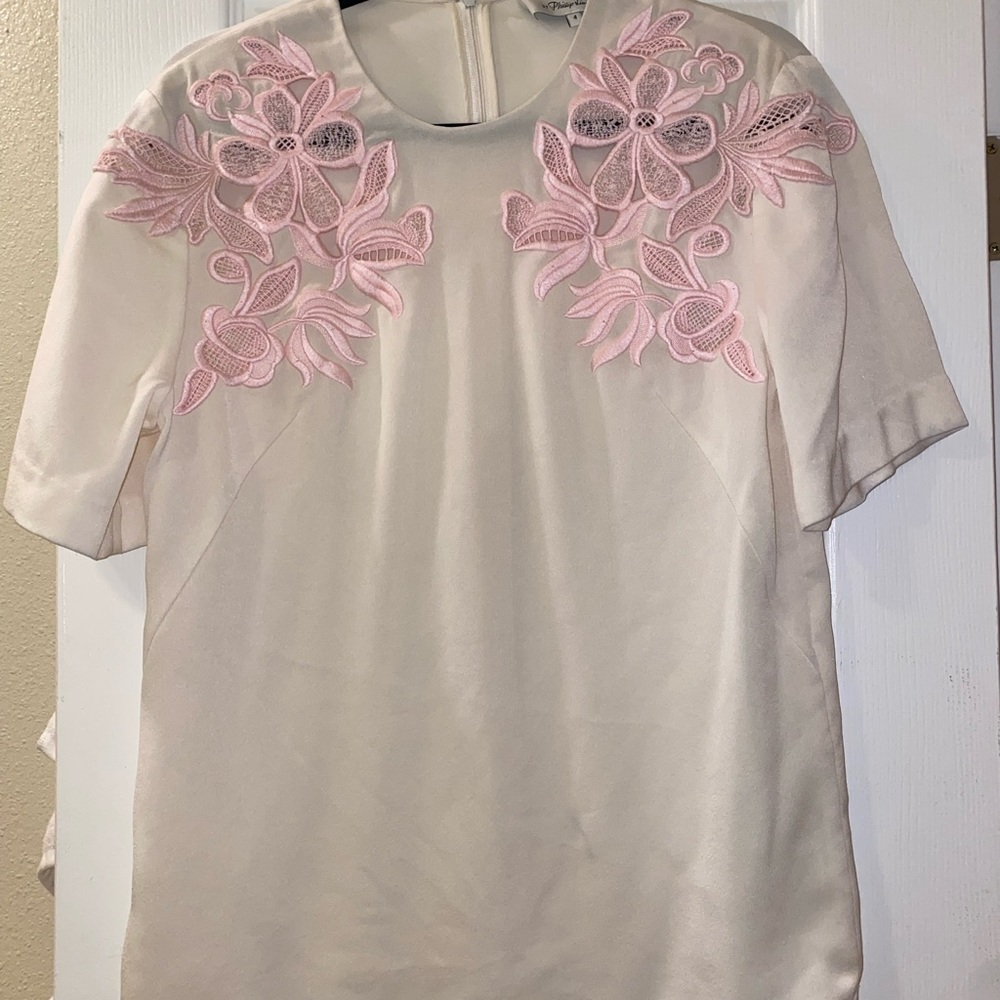 beautiful phillip lim cream blouse with light pink detail.